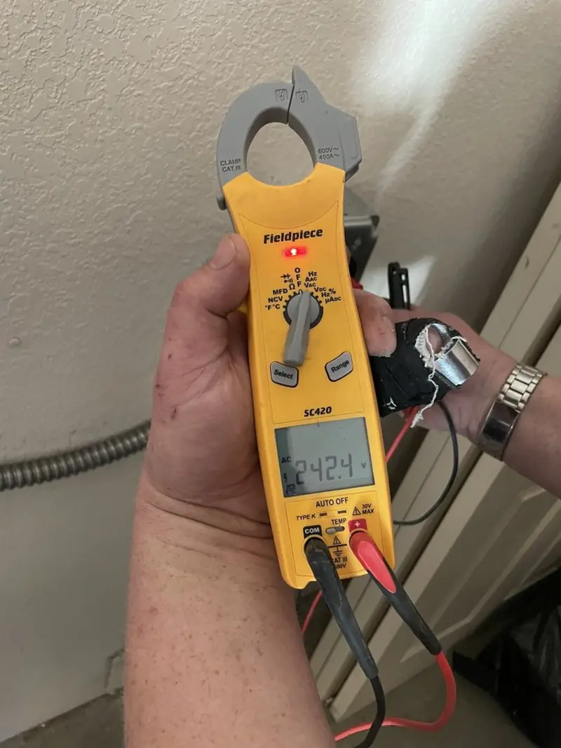 Voltage testing with clamp meter during Circuit Breaker Repair in Keller